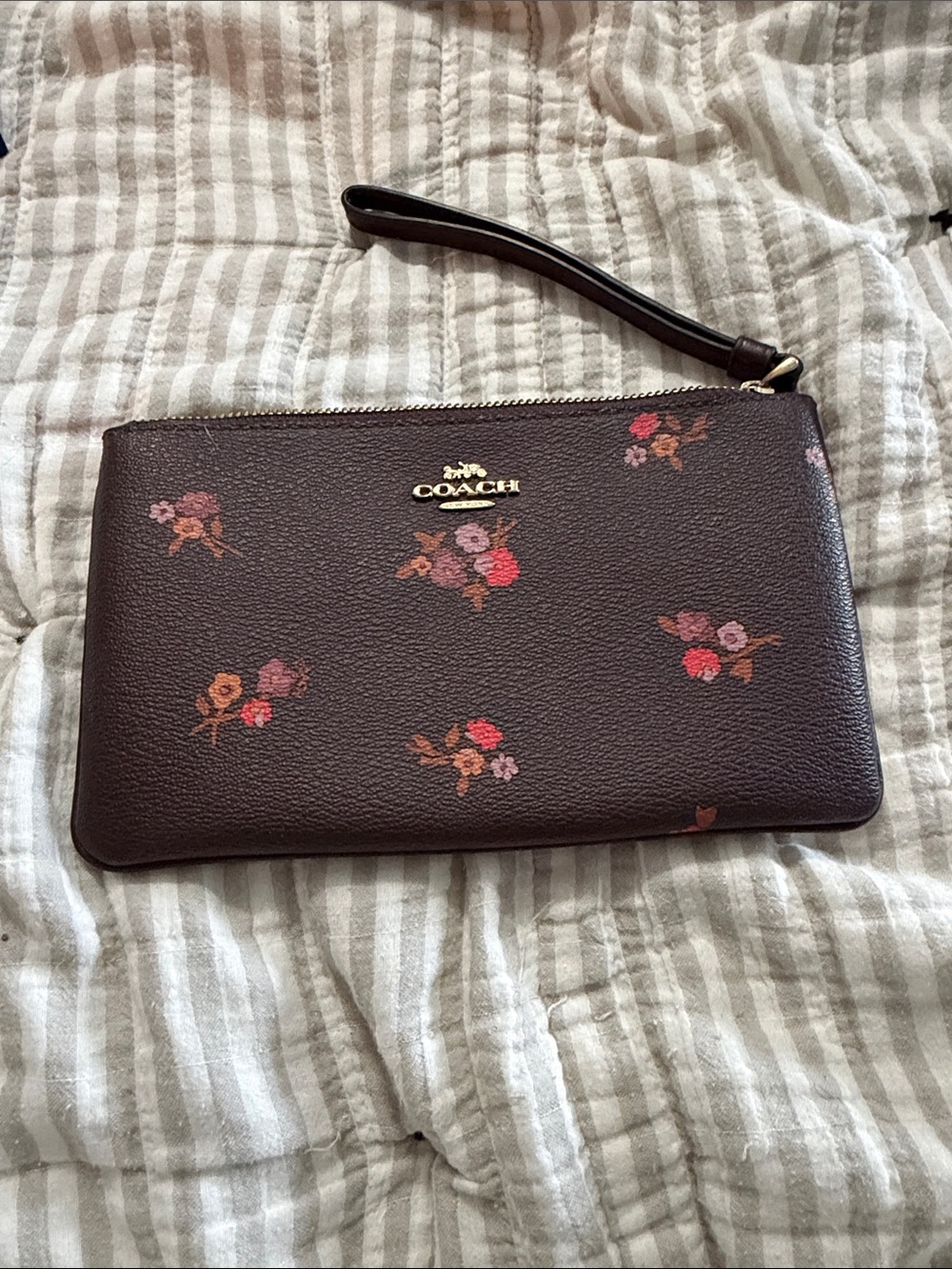 COACH Dark Brown Floral Leather Wristlet with Gold Logo